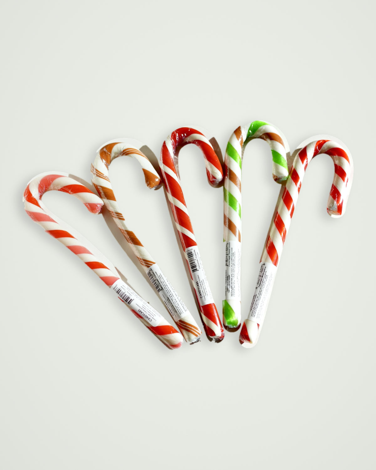 All 5 Candylabs Jumbo candy cane flavours fanned out: peppermint, cherry, cinnamon, caramel apple and salted caramel