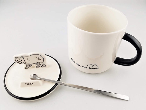Tasse en céramique avec support de téléphone en forme d'animal sur le couvercle
