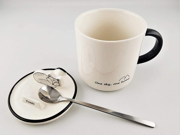 Ceramic mug with animal shaped phone stand on lid
